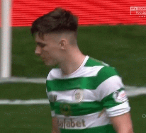 Soccer Player in Green and White Jersey