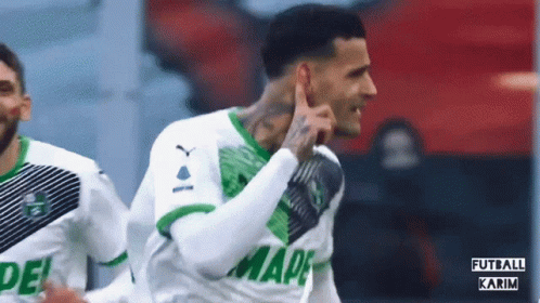 Soccer Player in Green and White Shirt Saying Mape