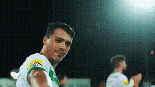 Soccer Player in Green and White Uniform