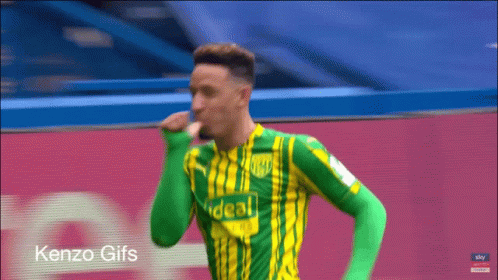 Soccer Player in Green and Yellow Shirt Saying Ideal
