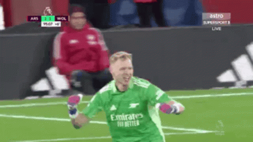 Soccer Player in Green Emirates Jersey Celebrates Goal