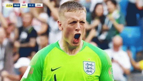 Soccer Player in Green Jersey Celebrating Goal