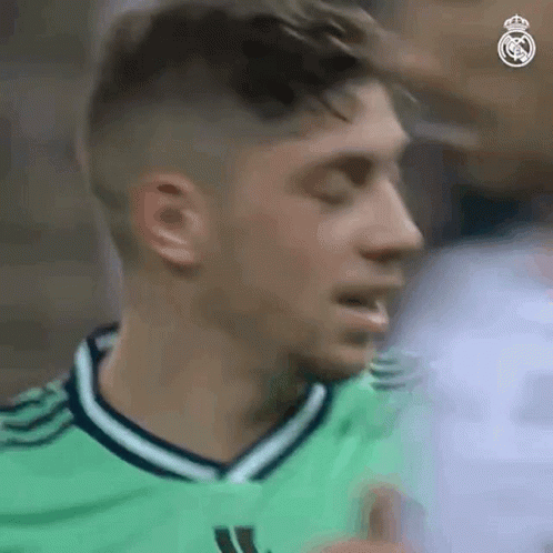 Soccer Player in Green Jersey Giving Thumbs Up