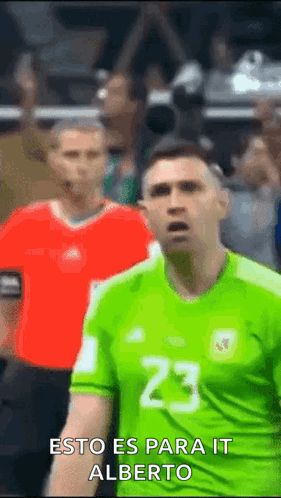 Soccer Player in Green Jersey Number 23 in Front of Crowd