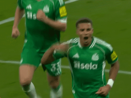 Soccer Player in Green Jersey Saying Sela
