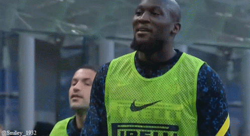 Soccer Player in Green Nike Vest Smiling