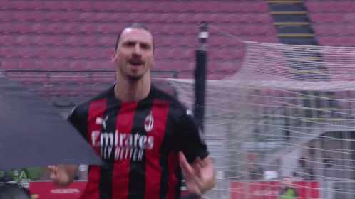 Soccer Player in Jersey Saying Emirates Fly Better