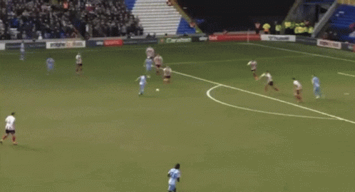 Soccer Player in Light Blue Jersey Number 20 Running