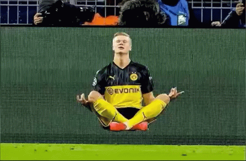 Soccer Player In Lotus Position With Crowd Watching GIF