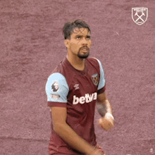 Soccer Player in Maroon Jersey Number 10