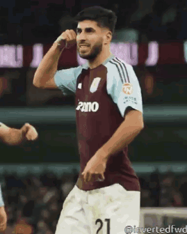 Soccer Player in Maroon Jersey Number 21
