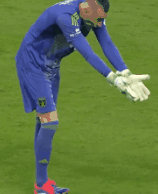 Soccer Player In Mask And Gloves Kneeling GIF
