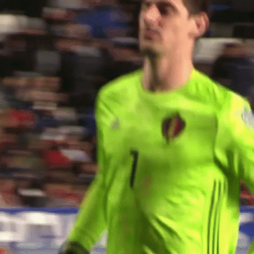 Soccer Player in Neon Green Jersey Number 1