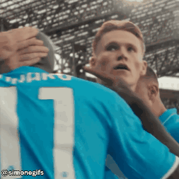 Soccer Player in Number 1 Jersey Hugging Another