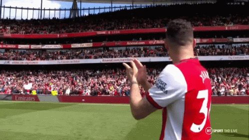 Soccer Player in Number 3 Jersey Applauds Crowd