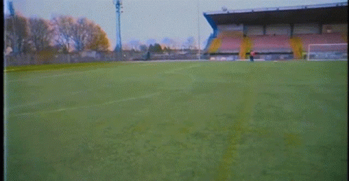 Soccer Player in Number 7 Jersey Kicking Ball