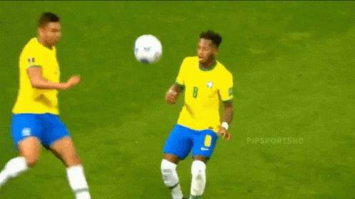 Soccer Player in Number 8 Jersey Kicking Ball