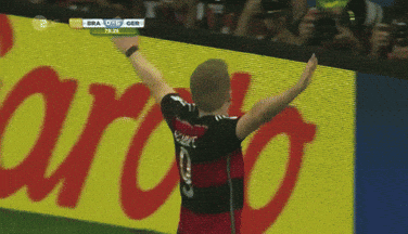 Soccer Player in Number 9 Jersey Pointing to Crowd