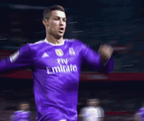 Soccer Player In Purple Emirates Jersey Celebrating Goal GIF