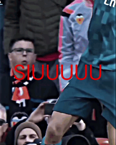 Soccer Player in Purple Fly Emirates Jersey Laughing in Front of Crowd