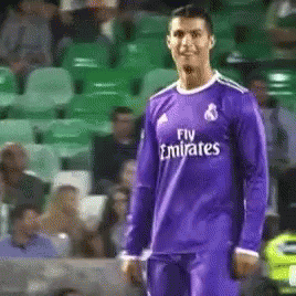 Soccer Player in Purple Fly Emirates Shirt