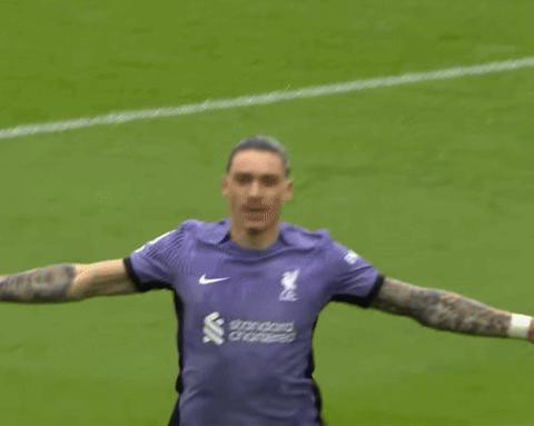 Soccer Player in Purple Running on Field