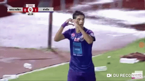Soccer Player in Purple Shirt Celebrating Goal