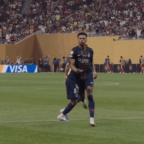 Soccer Player in Qatar Airways Jersey Running