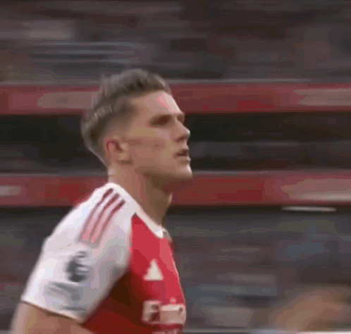 Soccer Player in Red Adidas Jersey Running