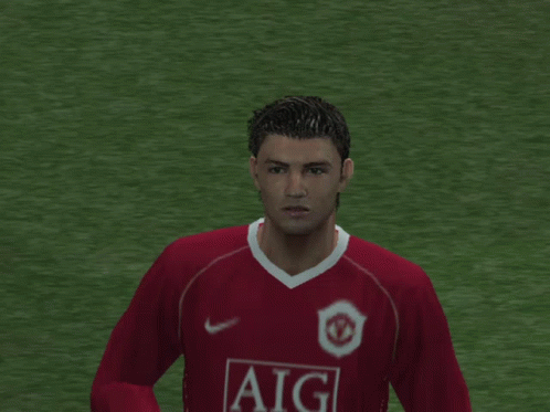 Soccer Player in Red Aig Jersey Raising Fist