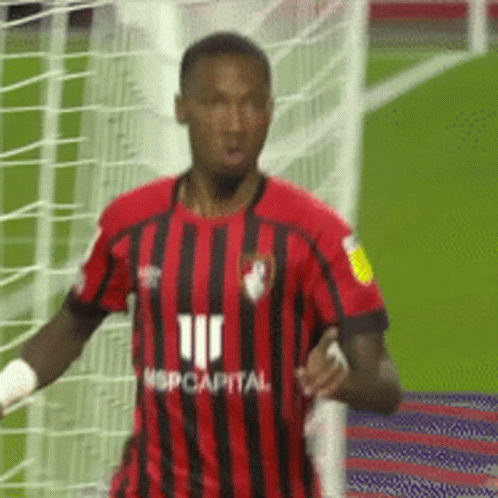 Soccer Player in Red and Black Jersey