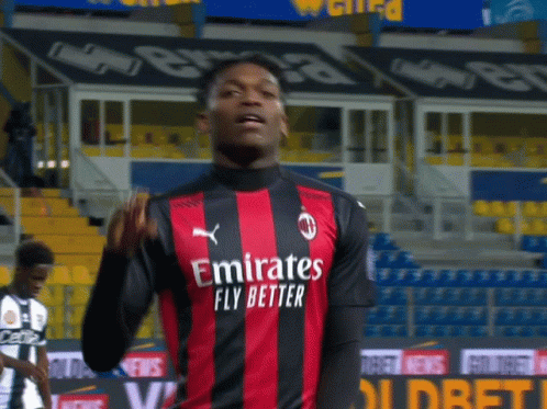Soccer Player in Red and Black Jersey
