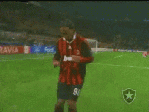 Soccer Player in Red and Black Jersey Number 8