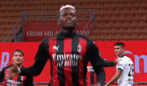 Soccer Player In Red And Black Jersey With Emirates GIF