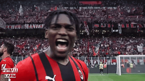 Soccer Player In Red And Black Puma Jersey Screaming GIF