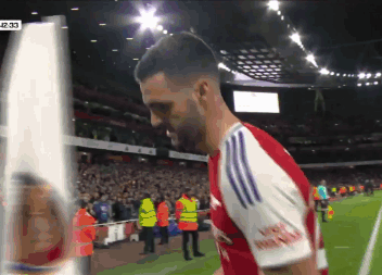 Soccer Player in Red and White Arsenal Jersey