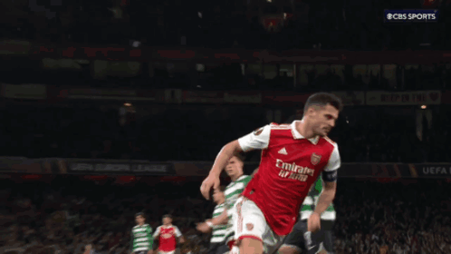 Soccer Player in Red and White Emirates Jersey
