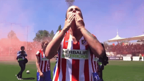 Soccer Player in Red and White Herbalife Shirt