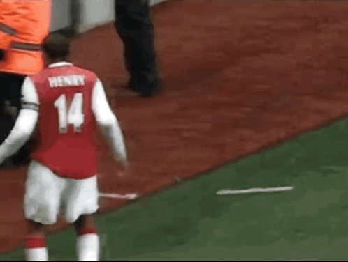 Soccer Player In Red And White Jersey Number 14 GIF