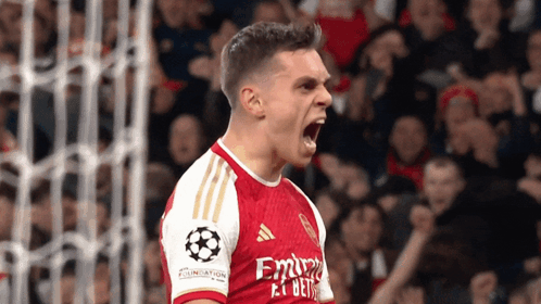 Soccer Player in Red and White Jersey with Emirates