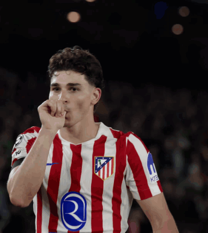 Soccer Player In Red And White Striped Jersey With Letter R GIF