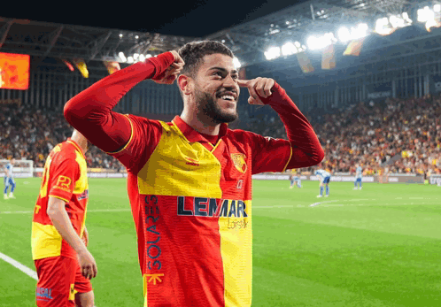 Soccer Player In Red And Yellow Lemar Shirt GIF