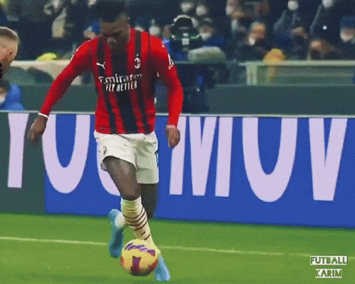 Soccer Player In Red Emirates Fly Better Jersey Kicking Ball GIF