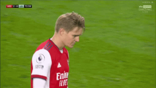 Soccer Player In Red Emirates Fly Better Shirt Talking To Another Player GIF