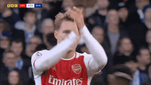Soccer Player In Red Emirates Jersey Clapping GIF
