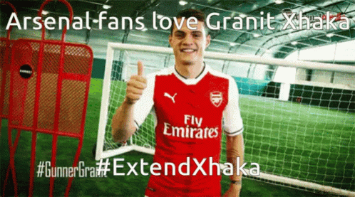 Soccer Player in Red Emirates Jersey Giving Thumbs Up