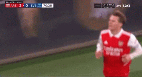 Soccer Player in Red Emirates Jersey Making Funny Face