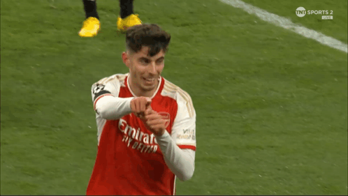 Soccer Player in Red Emirates Jersey