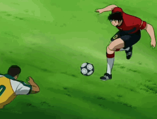 Soccer Player in Red Jersey Number 10 Kicking Ball