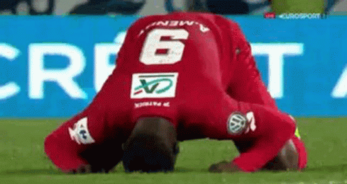 Soccer Player in Red Jersey Number 6